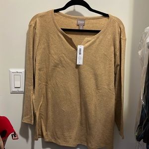 Tan/straw colored Chico’s 3/4 sleeve shirt with v-cut neck. Never worn with tags